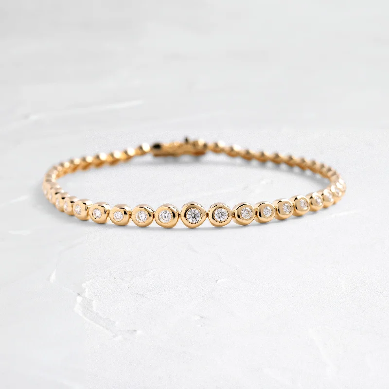 Rose gold bangles with geometric cutout designs -Graduated Diamond Pillow Eternity Bracelet - In Stock