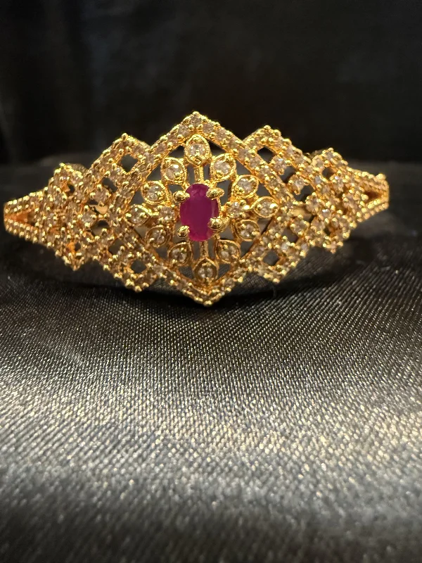 Bangles with faceted garnet for deep shine -Alluring Gold Plated With Hot Pink And White Stone Bracelet With a Beautiful Design