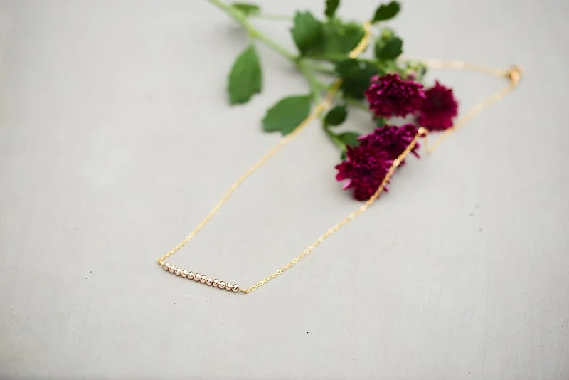 Necklaces and pendants with abstract shapes for a modern, creative appearance-Rosalie Gold Bar Necklace